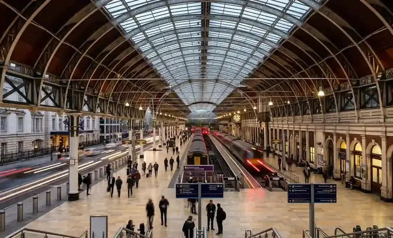The arched glass roof and busy concourse inside Paddington station